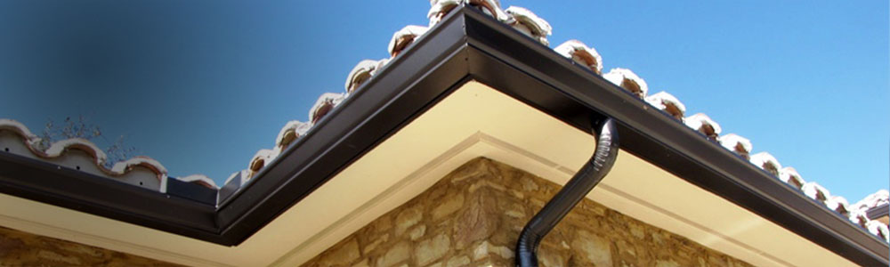 Dark bronze seamless gutter with a mitered corner on a Rancho Rain Gutters installation